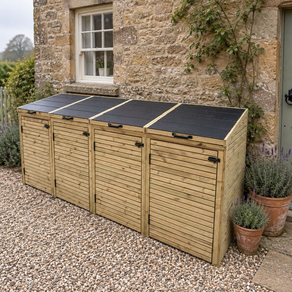 Four-bay wooden wheelie bin store with a slate-tiled roof