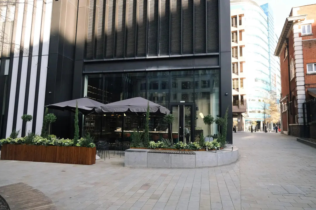 Bespoke outdoor bar area with heavy duty planters and seating