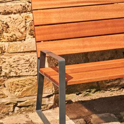 A premium outdoor garden bench made from premium sapele hardwood and robust UK steel. Made in the UK and built to withstand the UK weather.