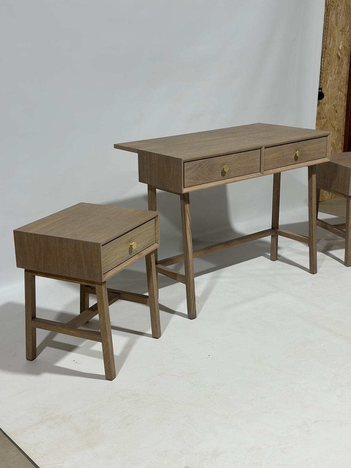 Finished bespoke desk and pair of bedside tables in the workshop