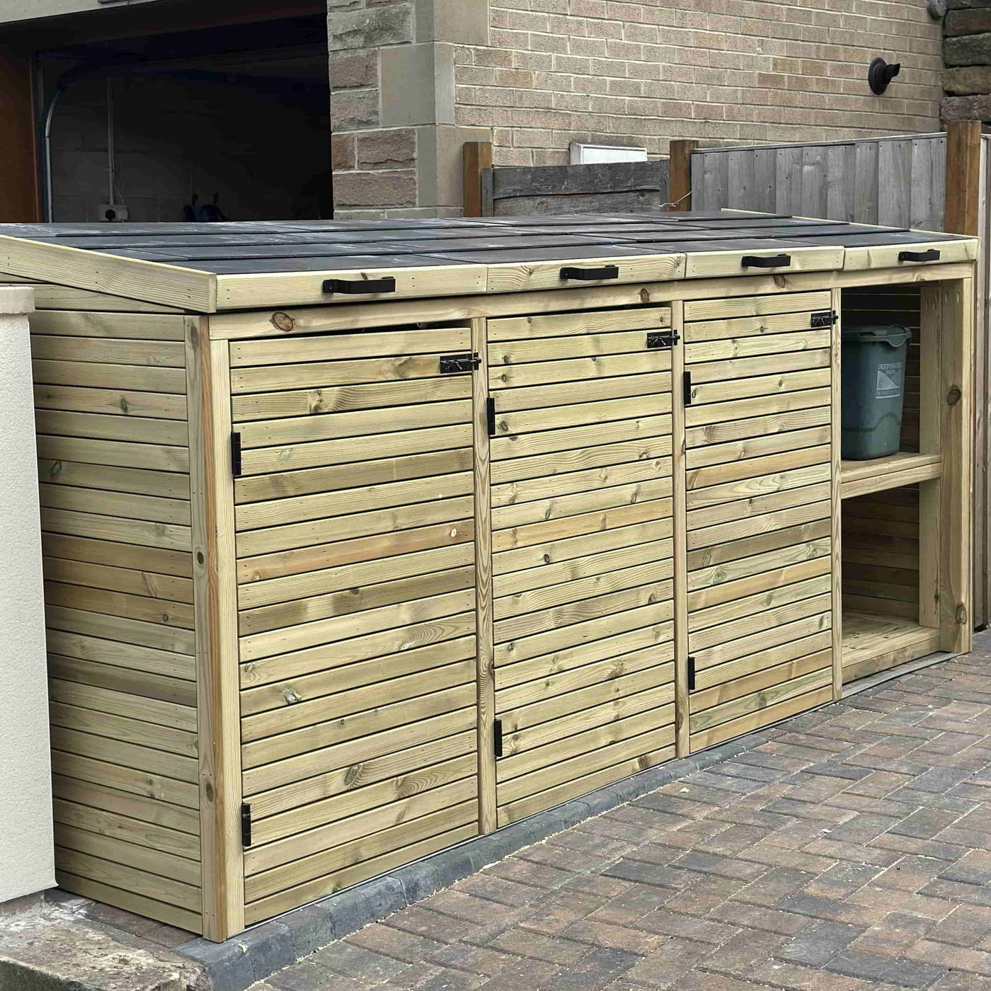 Triple wooden wheelie bin store with tiled roof and parcel bay, handcrafted timber bin storage.