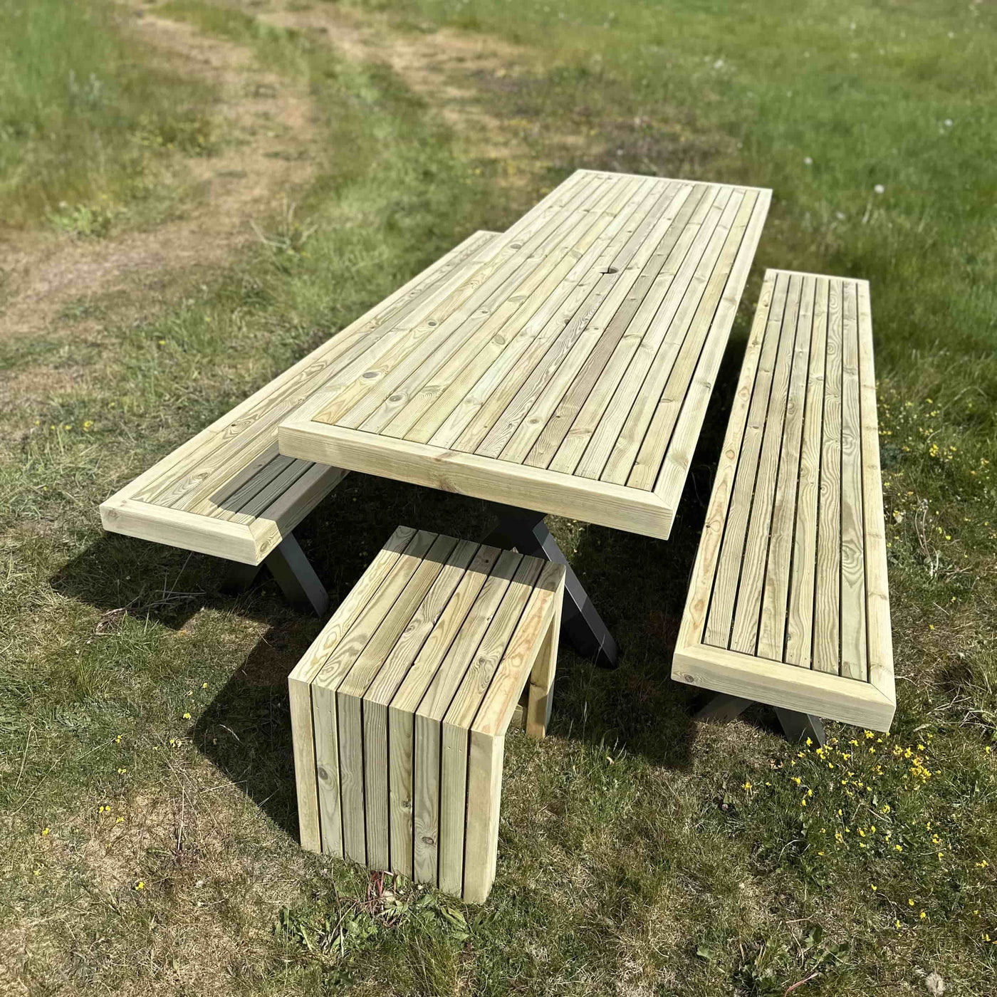 Wooden garden dining set with full-length benches and steel X legs, ideal for large outdoor gatherings and patios.