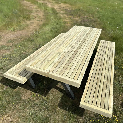 Wooden garden dining set with full-length benches and steel X legs, ideal for large outdoor gatherings and patios.