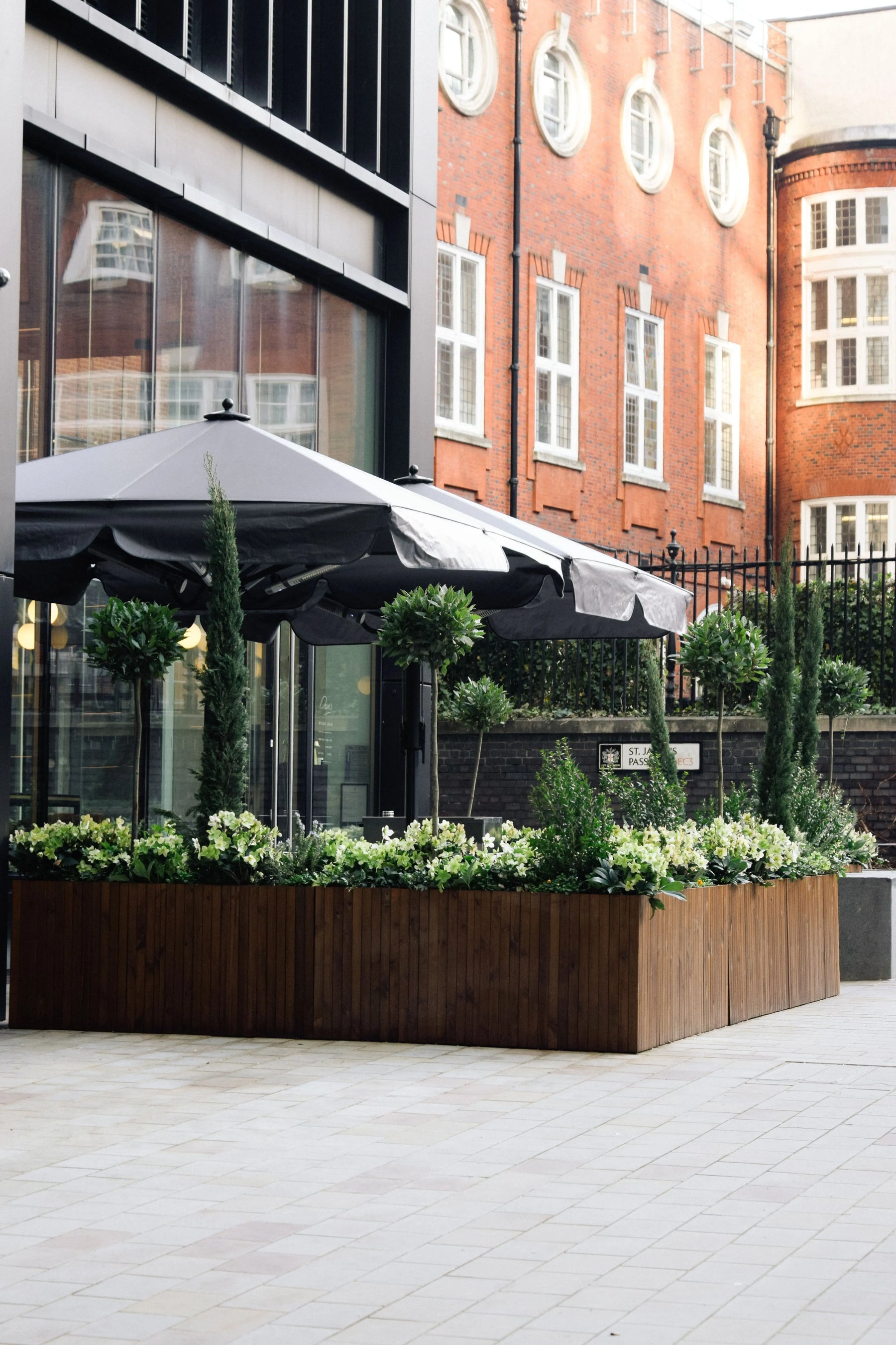 Bespoke outdoor bar area with heavy duty planters and seating