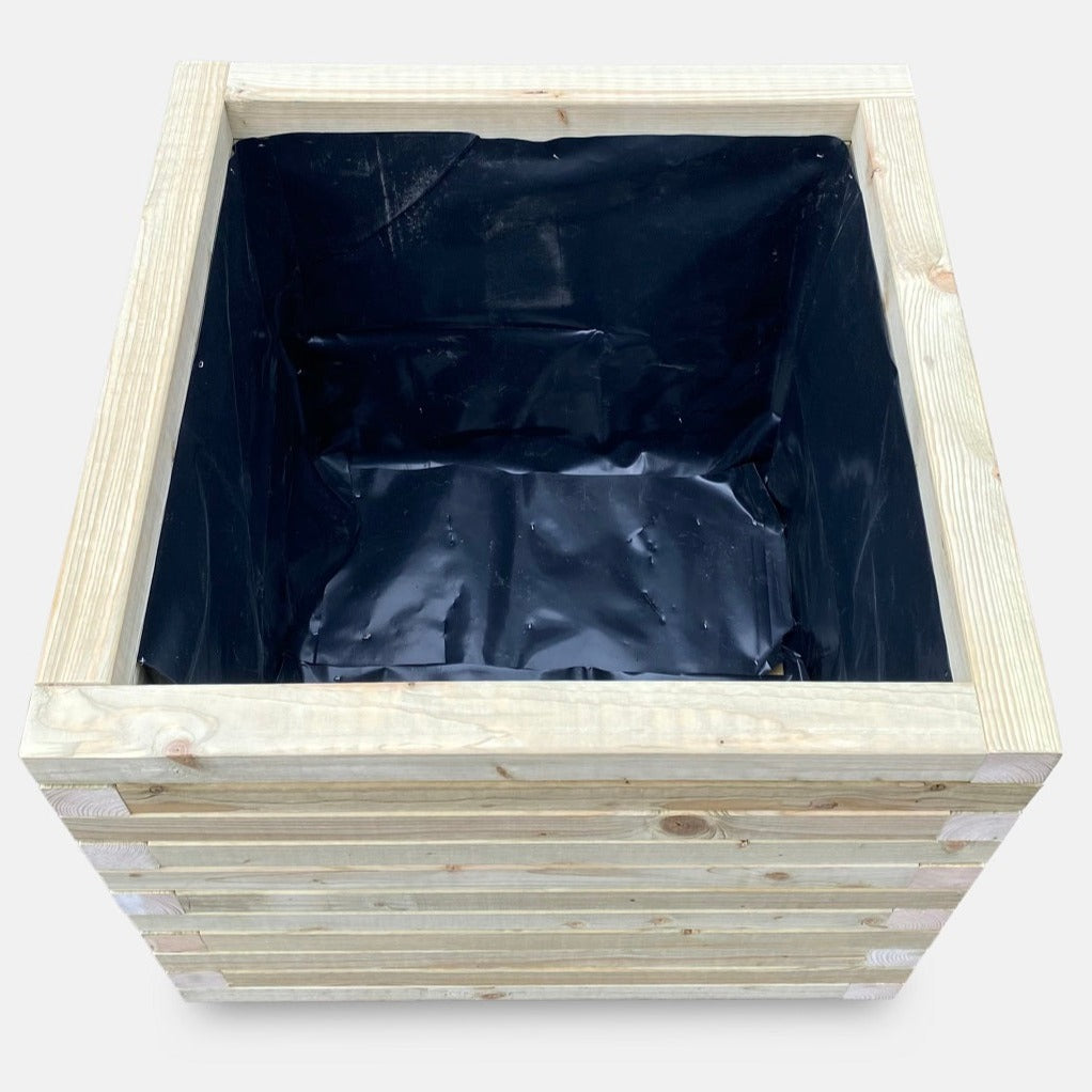 Large square garden planter in natural finish. This top down view shows the inside of the lined garden planter. Made from durable timber and ready for planting.
