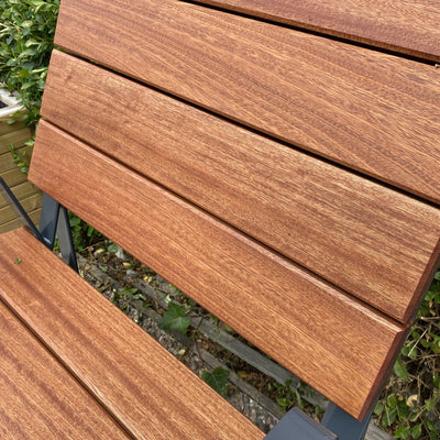 A close-up view of a Wooden Garden Chair crafted from durable Sapele hardwood. 